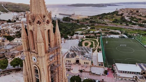 Aerial view of Malta's coastal landscape and architecture during daylight