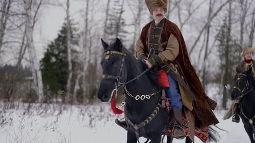 Brave Nobleman of Ancient Ruthenia or Poland Riding Horse in Winter Portrait in Movement Slowmo