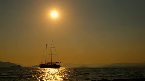 Silhouette of a Sailboat During Beautiful Ocean Sunset