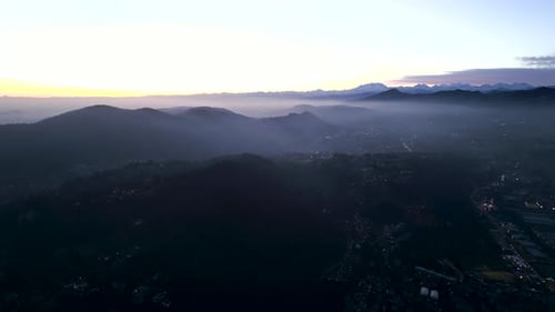 Aerial View of a Village in the Mountains with Fog