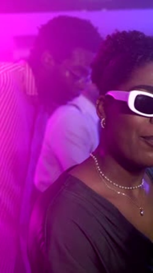 Women dancing and enjoying nightlife in a vibrant club