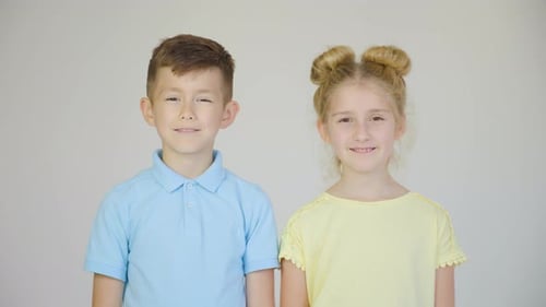 Smiling Boy and Girl Standing Together
