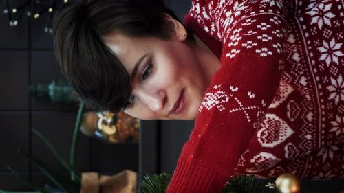 Decorating a Christmas Tree with Ornaments at Home