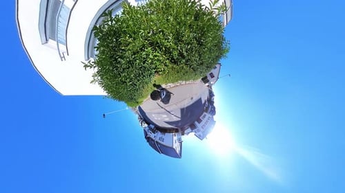 Little Tiny Planet 360 Small World View Of A Man Walking Past Large White Building in 4K