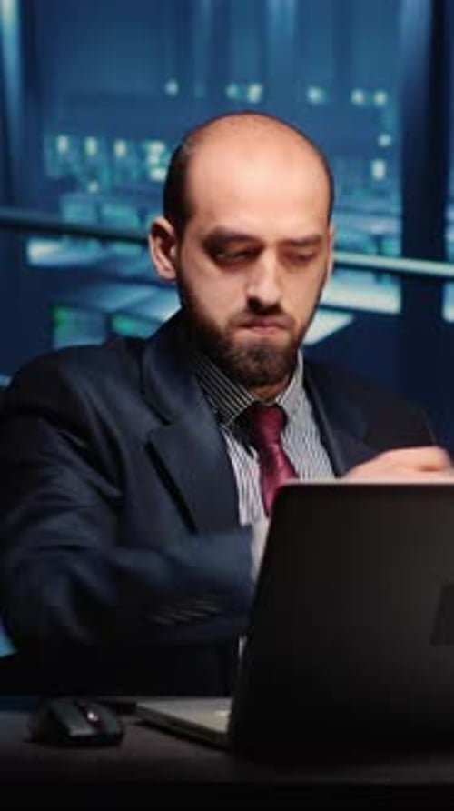 Vertical Video Male Infrastructure Engineer Working in Render Farm