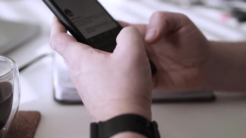 Man scrolling social media in smartphone