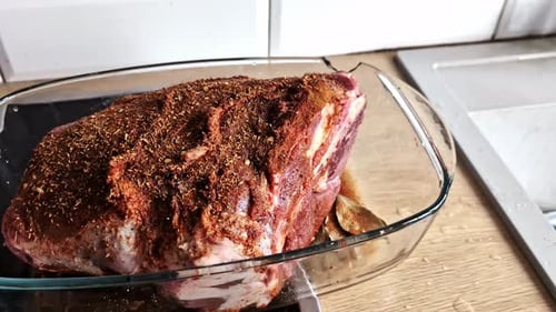 Raw Meat with Spices in a Glass Pot, Ready to Be Cooked
