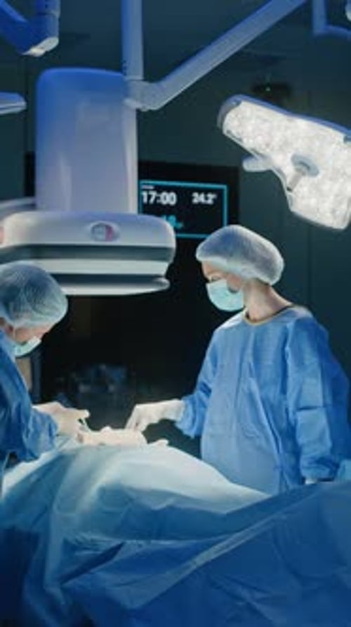 Surgeon and Assistance Communicating during Operation