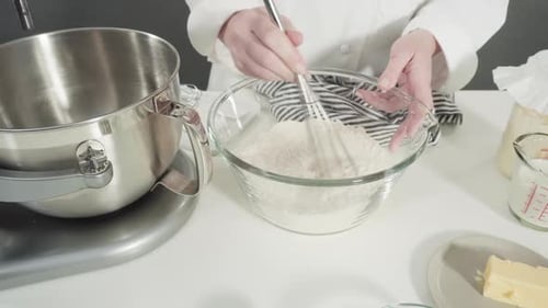 Mixing Ingredients in a Kitchen Standing Mixer to Bake Cinnamon Rolls