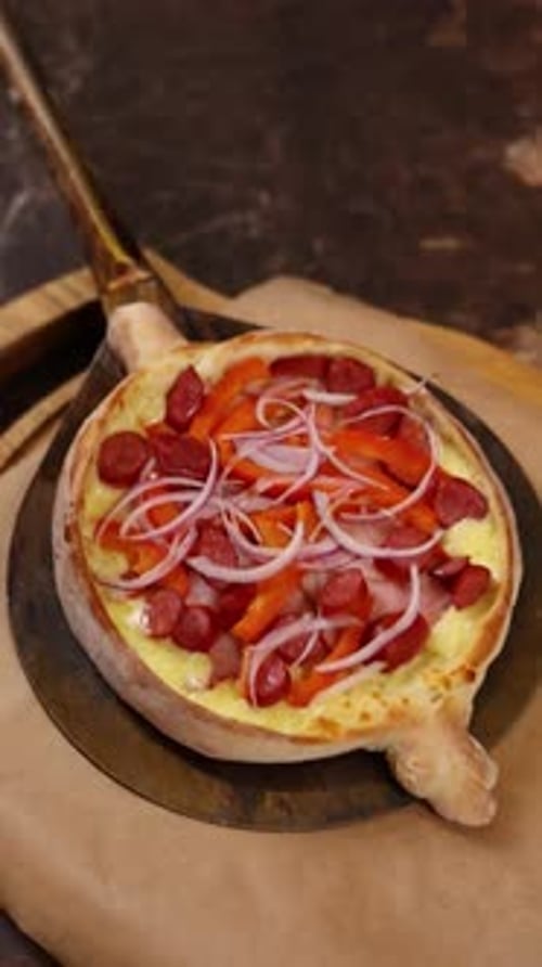 The chef cooks delicious khachapuri in the restaurant