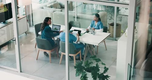 Doctors, meeting and group in boardroom at hospital, above and discussion with paperwork