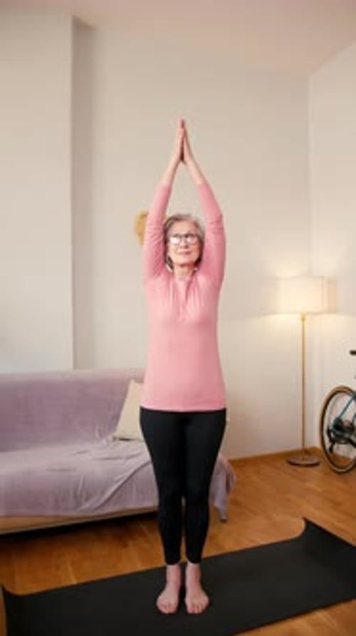 Senior Woman Performing Yoga in Home Interior