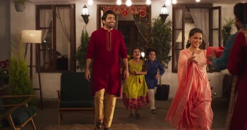 Family Welcomes Guests at Decorated Home Patio