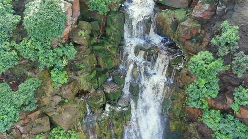 Aerial drone footage of a tall rocky waterfall in the Yorkshire Dales, Pennies. Moorland scene of a