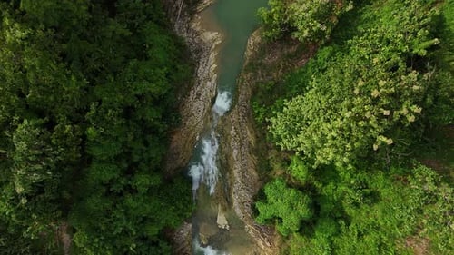 Drone view from top of small river on natural forest
