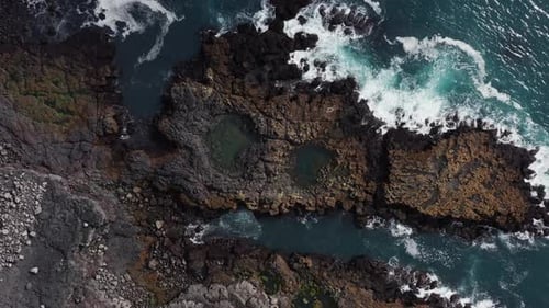 Top down of wild volcanic shore of Reykjanes peninsula with tide pools
