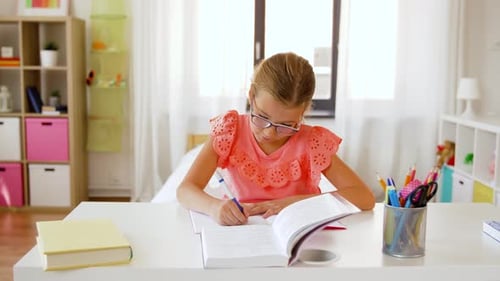 Girl Studying and Doing Homework at Desk