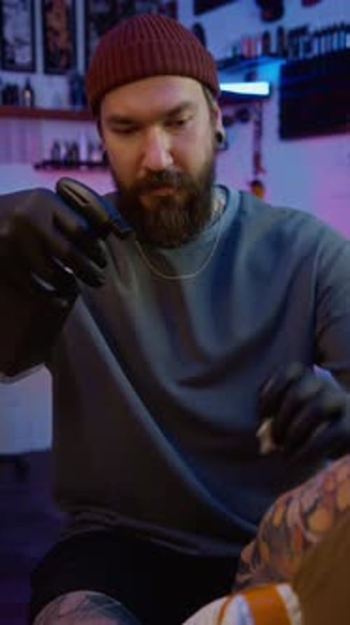 Tattoo Artist at Work in Studio