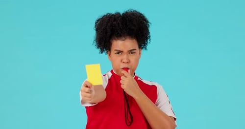Whistle, yellow card and woman referee in a studio with rules for a football match
