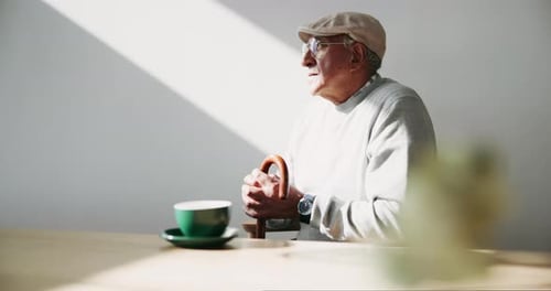 Relax, thinking and senior man in coffee shop with drink, cappuccino or calm morning break