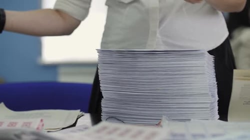 Sorting Through Stacked Documents at a Workplace
