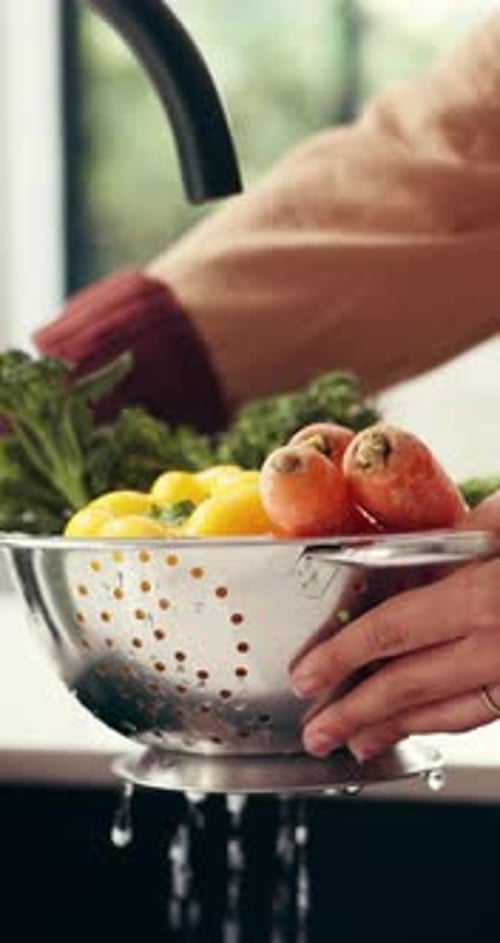 Hands, washing and vegetables in kitchen with water for meal prep, fresh food and healthy nutrition