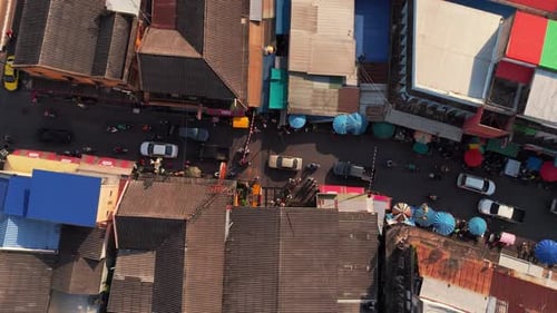 Maeklong Railway Market, a must-visit Bangkok day trip, with vibrant market stalls and moving trains