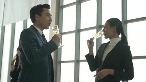 White collar workers are celebrating at office.