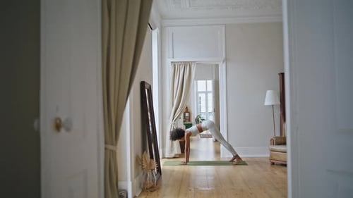 Woman Doing Yoga in Bright Home Interior