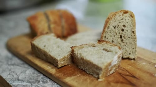 Sliced Bread on a Wooden Cutting Board