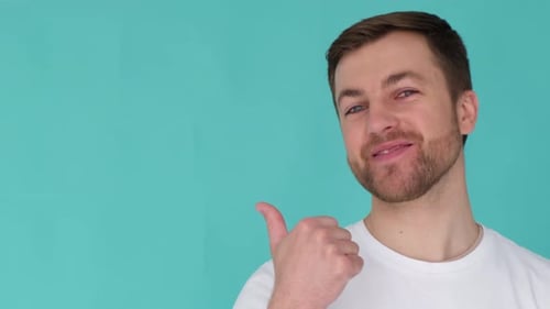 Handsome Man Showing Class and Looking at Camera in Slow Motion in Studio