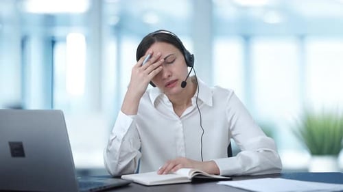 Angry Indian call center girl talking to customer and taking notes