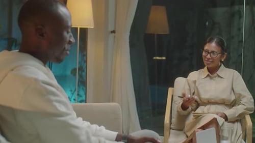 Man Talking to Woman in Office