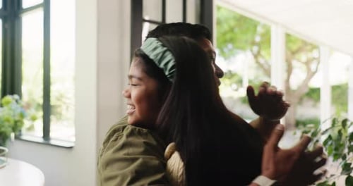 Dad and Daughter Embracing in a Modern Home