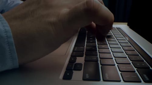 Alternative Macro Close Up of an Young Business Man Hands Busy Working on Laptop or Computer