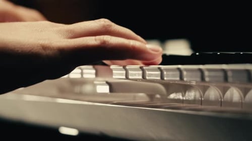 Fingers Gracefully Playing a Piano Keyboard