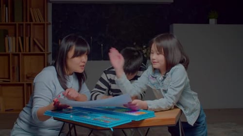 Family Fun: Woman and Children Drawing Together