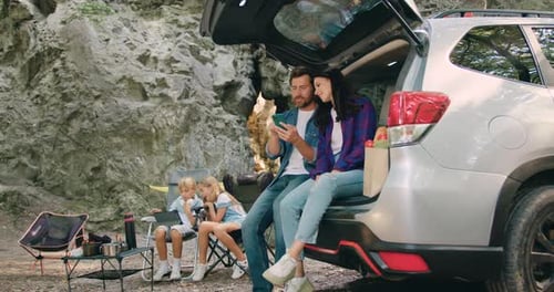 Family Relaxing Together on a Camping Trip