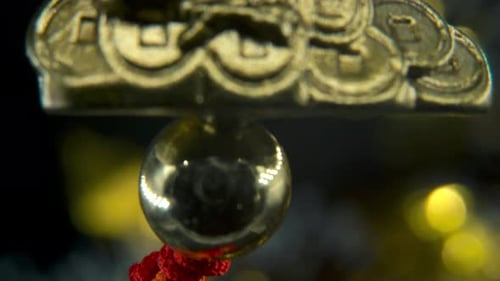 Chinese New Year traditional golden chicken zodiac statue, hanging gold rooster sitting on money coi