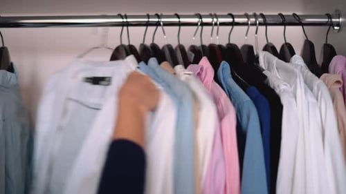 Colorful Shirts Hanging in Wardrobe Closet