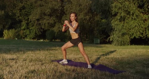 Woman Doing Lateral Squats in a Park