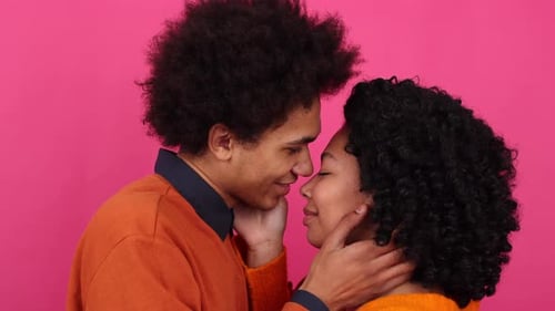 Loving Young Couple Embraces in Tender Moment