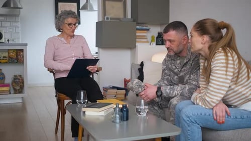 Couple Talking with Therapist in Living Room Setting
