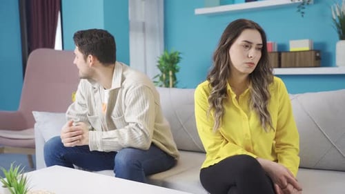 Frustrated Couple with Relationship Problems Sitting Apart