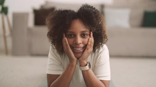 Smiling Woman with Braces Posing in an Apartment