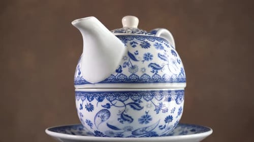 Rotating Double Handle Ceramic Teapot. Close Up