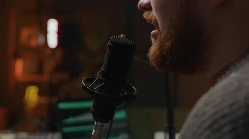 Young Man Speaking in Mic in Studio during Podcasting