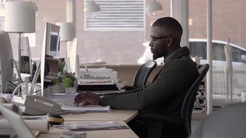 Businesswoman Using Desktop Computer in Office Achievement