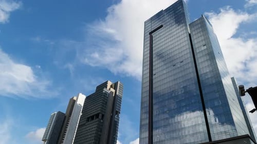 Modern Buildings with a Glass Facade Skyscrapers of the City's Business District Timelapse