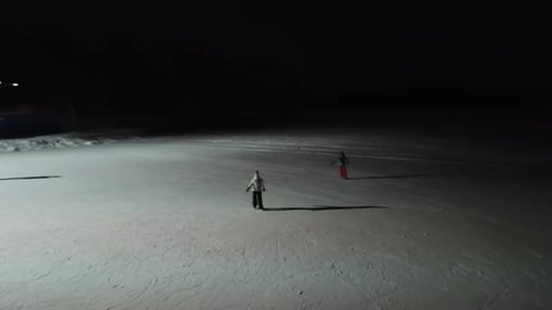 people ice skating at night